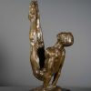 bronze sculpture of male gymnast side view