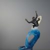 Bronze and Glass Sculpture of a surfer obtaining maximum air.