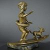Bronze sculpture of little surfer girl with dog - right side view