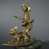 Bronze sculpture of little surfer girl with dog