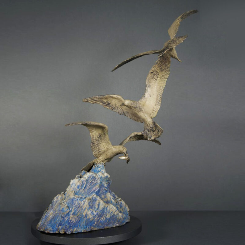 Three Gulls in Flight on Base