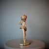 Bronze sculpture of little girl doing a ballet pose in her tutu - left side