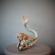 Bronze sculpture of a mermaid and oyster shell with a surprise pearl inside - front
